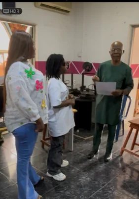 A learner receiving recognition at WOCOET